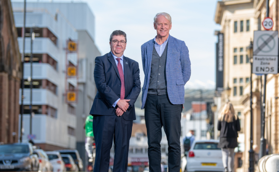 The Vice Chancellors of Newcastle University and Northumbria University stood on Northumberland Road in the centre of Newcastle